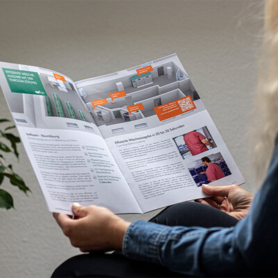 teXtag Brochure teXtag Brochure is held by a women