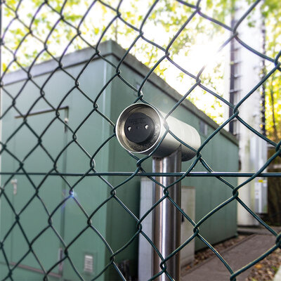 digital safe digital safe behind wire mesh fence