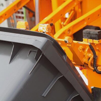 Emptying waste bin Cut-out of a rubbish bin being emptied
