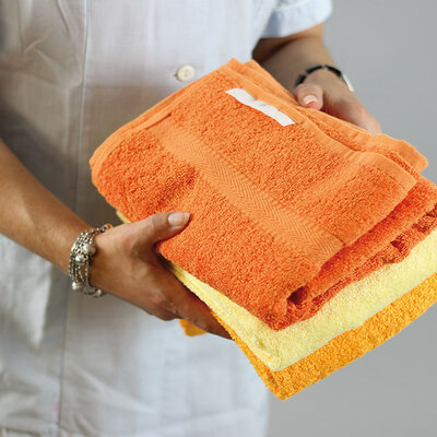 Manage towels digitally Nurse holding towels